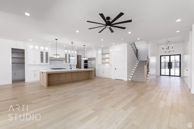 671 E Arina Way, Washington, UT 84780 - kitchen featuring open floor plan, tasteful backsplash, a chandelier, light wood-type flooring, and recessed lighting