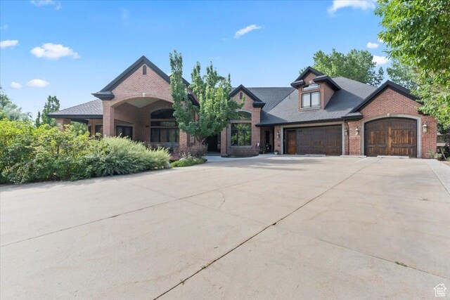 3149 E 9800 S, Sandy, UT 84092 - view of front facade with brick siding, concrete driveway, and a garage