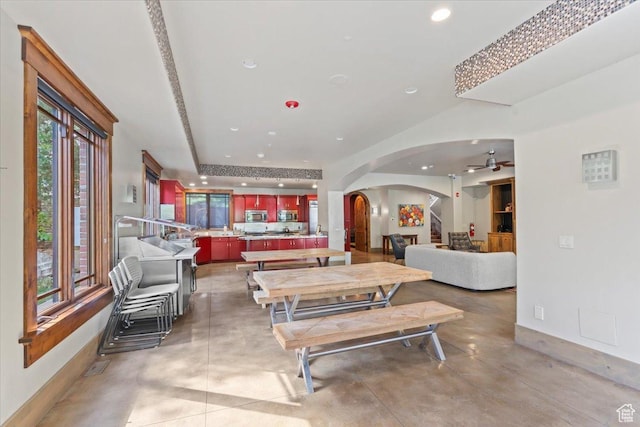 3149 E 9800 S, Sandy, UT 84092 - living room with arched walkways, concrete flooring, recessed lighting, and a ceiling fan