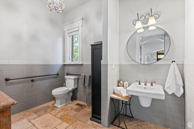 3149 E 9800 S, Sandy, UT 84092 - bathroom featuring tile walls and a wainscoted wall