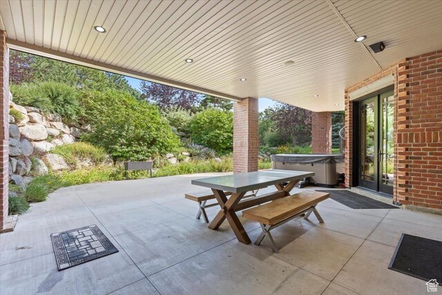 3149 E 9800 S, Sandy, UT 84092 - view of patio / terrace with outdoor dining area, a hot tub, and french doors