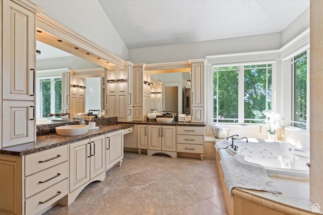 3149 E 9800 S, Sandy, UT 84092 - full bathroom featuring vanity, a tub with jets, and vaulted ceiling