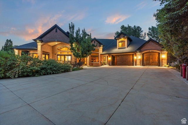 3149 E 9800 S, Sandy, UT 84092 - view of front facade featuring brick siding, concrete driveway, and a garage