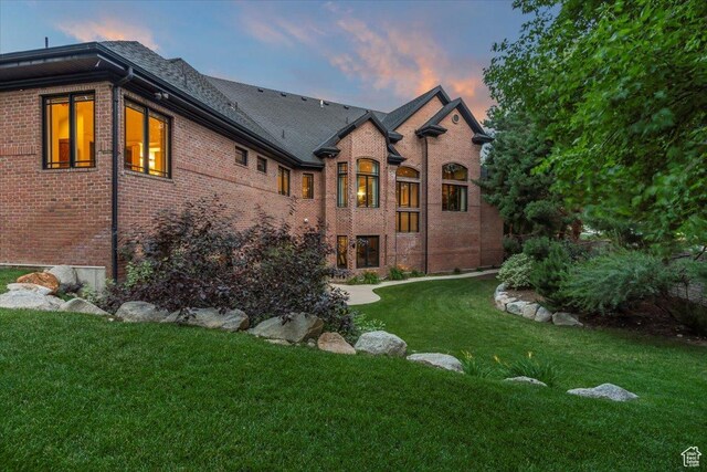 3149 E 9800 S, Sandy, UT 84092 - rear view of house with brick siding and a yard