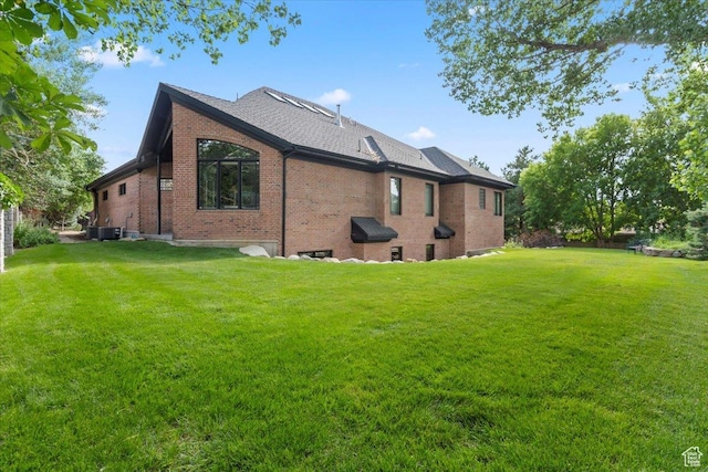 3149 E 9800 S, Sandy, UT 84092 - view of side of home featuring brick siding, a yard, and a shingled roof