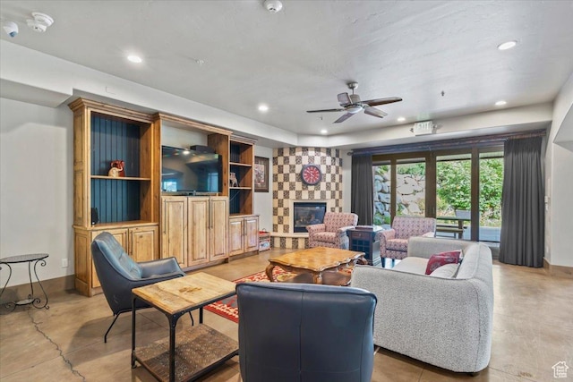 3149 E 9800 S, Sandy, UT 84092 - living area with a stone fireplace, recessed lighting, concrete floors, and a ceiling fan