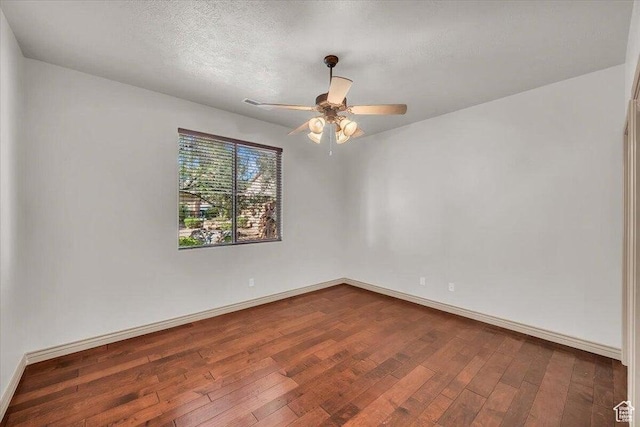1319 W Red Butte Dr W, Washington, UT 84780 - unfurnished room featuring dark wood finished floors and ceiling fan