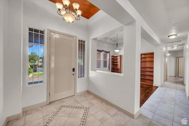 1319 W Red Butte Dr W, Washington, UT 84780 - foyer entrance with a chandelier and light tile patterned flooring