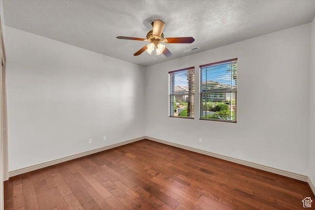 1319 W Red Butte Dr W, Washington, UT 84780 - spare room featuring wood-type flooring, ceiling fan, and a textured ceiling
