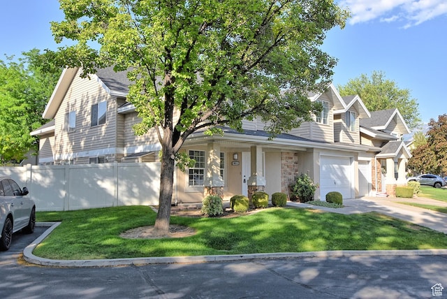 1323 S 1260 W, Orem, UT 84058 - view of front of house with driveway, a garage, and stone siding