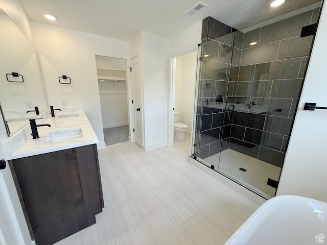 2237 E Parkside Cir S, South Ogden, UT 84403 - full bathroom featuring a shower stall, double vanity, a soaking tub, recessed lighting, and a spacious closet