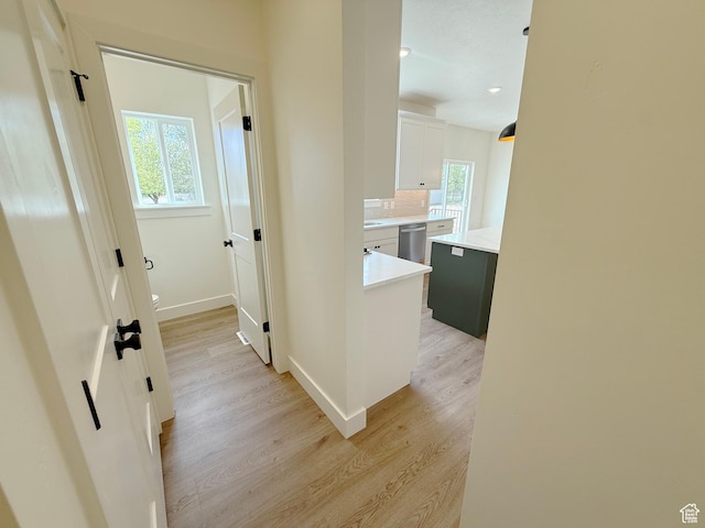2237 E Parkside Cir S, South Ogden, UT 84403 - corridor featuring light wood-style floors and baseboards