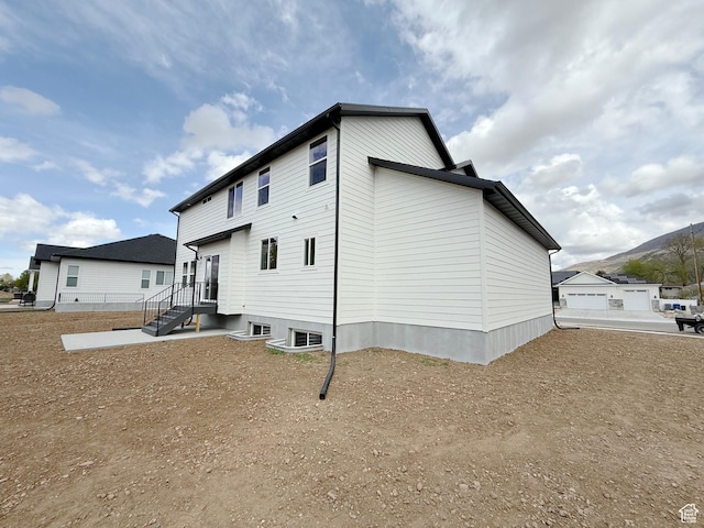 2237 E Parkside Cir S, South Ogden, UT 84403 - rear view of house featuring a mountain view