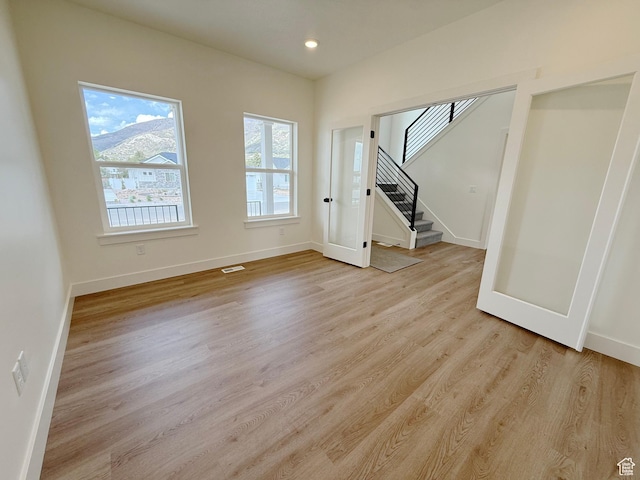 2237 E Parkside Cir S, South Ogden, UT 84403 - spare room featuring stairs, light wood-style floors, and recessed lighting