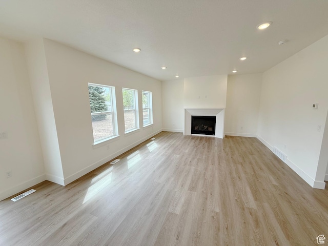 2237 E Parkside Cir S, South Ogden, UT 84403 - unfurnished living room featuring a fireplace, light wood-style flooring, and recessed lighting