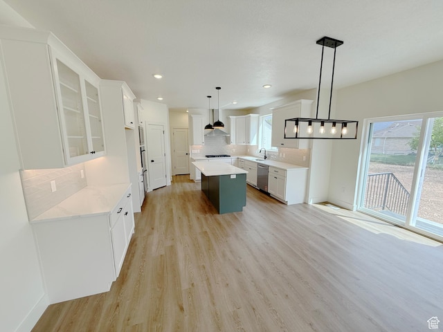2237 E Parkside Cir S, South Ogden, UT 84403 - kitchen with dishwasher, healthy amount of natural light, a kitchen island, light wood finished floors, and recessed lighting