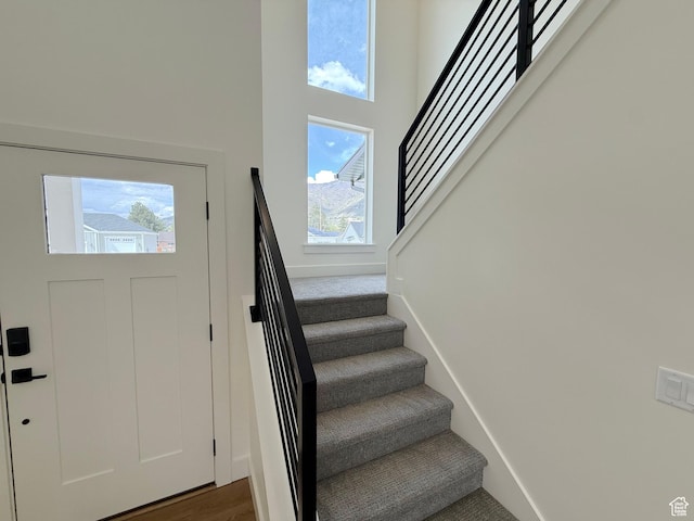 2237 E Parkside Cir S, South Ogden, UT 84403 - entrance foyer with healthy amount of natural light, stairway, and a high ceiling