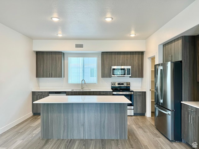 2345 W Miles Unit D15, West Haven, UT 84401 - kitchen with appliances with stainless steel finishes, modern cabinets, and a kitchen island