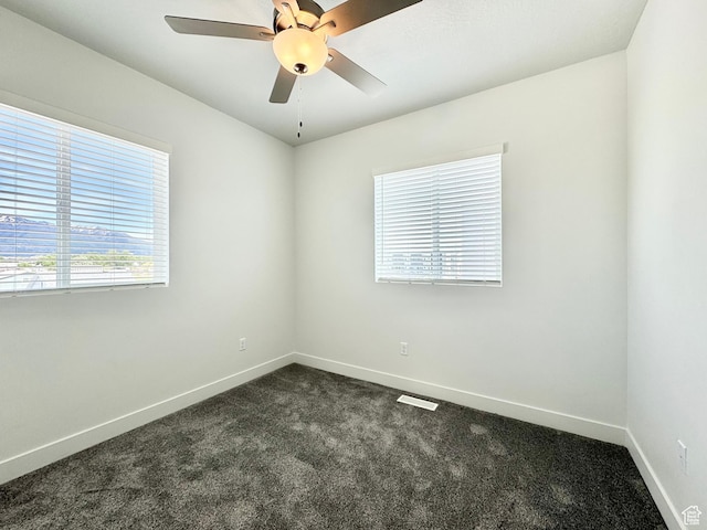 2345 W Miles Unit D15, West Haven, UT 84401 - spare room featuring dark colored carpet and ceiling fan