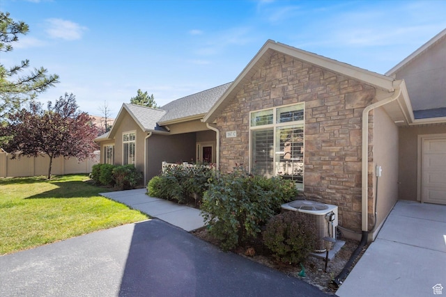 1867 W 9270 S Unit C, West Jordan, UT 84088 - view of home's exterior featuring stone siding and stucco siding