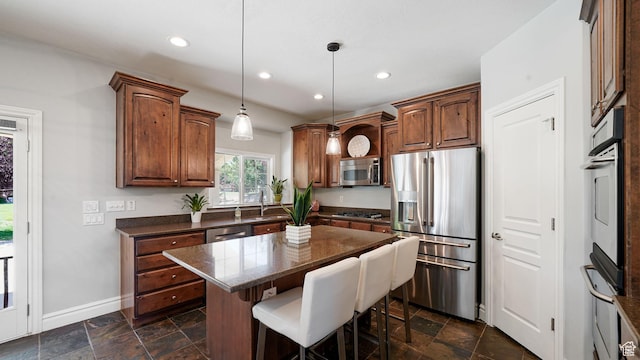 11597 N Sunset Hills Dr, Highland, UT 84003 - kitchen with stainless steel appliances, a breakfast bar, recessed lighting, stone tile floors, and a kitchen island