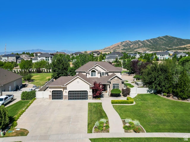 11597 N Sunset Hills Dr, Highland, UT 84003 - traditional-style home with stone siding, driveway, a residential view, stucco siding, and a mountain view