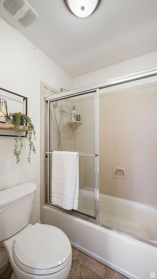 11597 N Sunset Hills Dr, Highland, UT 84003 - bathroom with toilet and bath / shower combo with glass door
