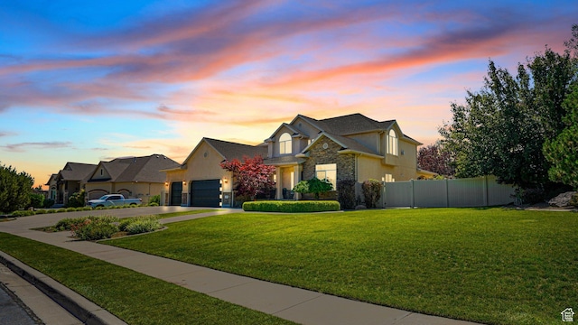 11597 N Sunset Hills Dr, Highland, UT 84003 - view of front of house with concrete driveway, a garage, and stone siding