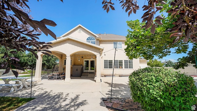 11597 N Sunset Hills Dr, Highland, UT 84003 - back of property featuring french doors, stucco siding, and a patio area