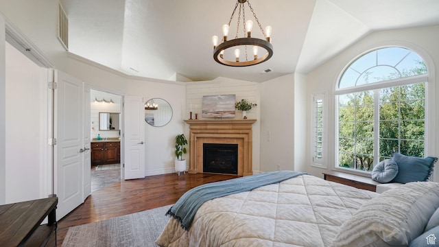 11597 N Sunset Hills Dr, Highland, UT 84003 - bedroom featuring lofted ceiling, a chandelier, wood finished floors, a fireplace, and ensuite bathroom