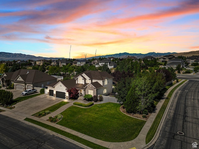 11597 N Sunset Hills Dr, Highland, UT 84003 - aerial view at dusk of a residential view and a mountain view