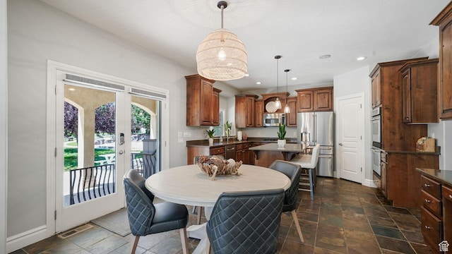 11597 N Sunset Hills Dr, Highland, UT 84003 - dining area with stone tile flooring, french doors, and recessed lighting