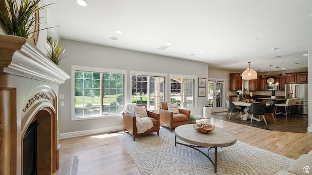 11597 N Sunset Hills Dr, Highland, UT 84003 - living area with a fireplace, light wood finished floors, and recessed lighting
