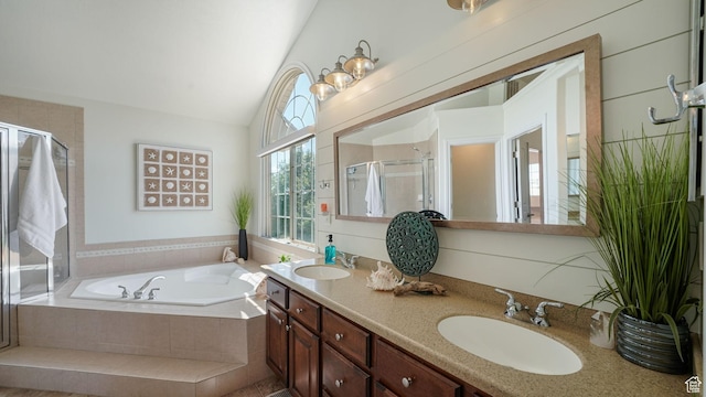 11597 N Sunset Hills Dr, Highland, UT 84003 - bathroom featuring a bath, a shower stall, double vanity, and vaulted ceiling