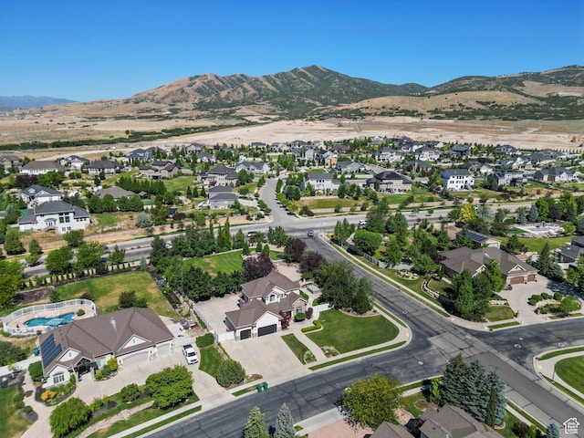 11597 N Sunset Hills Dr, Highland, UT 84003 - aerial view of property's location with nearby suburban area and a mountain backdrop