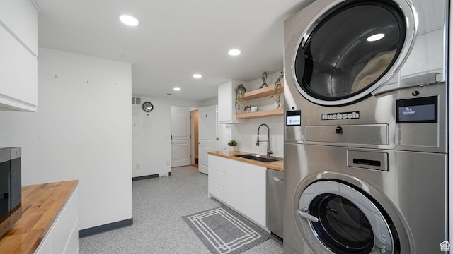 11597 N Sunset Hills Dr, Highland, UT 84003 - laundry room featuring stacked washer / drying machine and recessed lighting