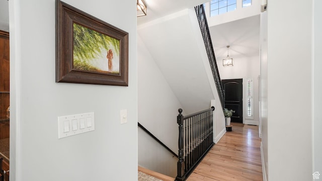 11597 N Sunset Hills Dr, Highland, UT 84003 - stairway featuring wood finished floors and baseboards