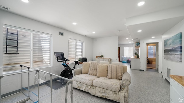 11597 N Sunset Hills Dr, Highland, UT 84003 - living area with dark aggregate flooring, recessed lighting, and healthy amount of natural light