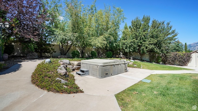 11597 N Sunset Hills Dr, Highland, UT 84003 - fenced backyard with a hot tub and a patio area