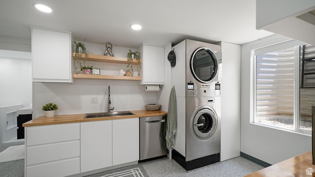 11597 N Sunset Hills Dr, Highland, UT 84003 - washroom featuring stacked washer and clothes dryer, recessed lighting, and healthy amount of natural light