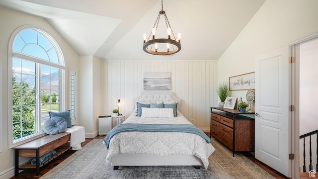 11597 N Sunset Hills Dr, Highland, UT 84003 - bedroom featuring multiple windows, a chandelier, vaulted ceiling, and wood finished floors
