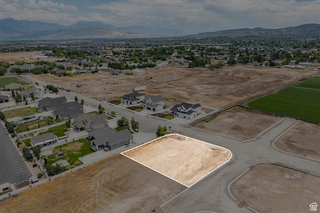 6158 W Silver Sky Dr W Unit 102, Herriman, UT 84096 - aerial view of property's location featuring property parcel outlined, a mountainous background, and nearby suburban area