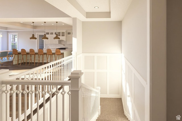 6158 W Silver Sky Dr W Unit 102, Herriman, UT 84096 - staircase with a raised ceiling, a decorative wall, wainscoting, and carpet floors