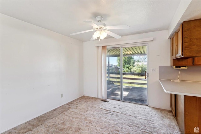 2989 W 700 S, Syracuse, UT 84075 - unfurnished dining area with light carpet and a ceiling fan