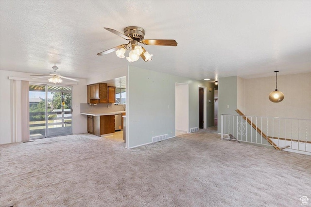 2989 W 700 S, Syracuse, UT 84075 - unfurnished living room with light carpet and a ceiling fan