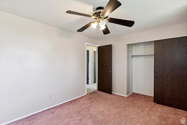 2989 W 700 S, Syracuse, UT 84075 - unfurnished bedroom with light colored carpet, a closet, and a ceiling fan