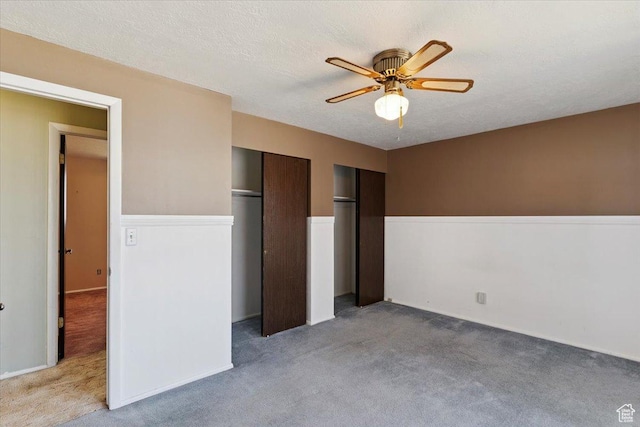 2989 W 700 S, Syracuse, UT 84075 - unfurnished bedroom with light carpet, two closets, and ceiling fan