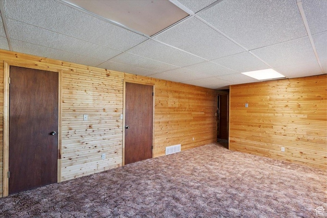 2989 W 700 S, Syracuse, UT 84075 - carpeted empty room with wood walls and a paneled ceiling