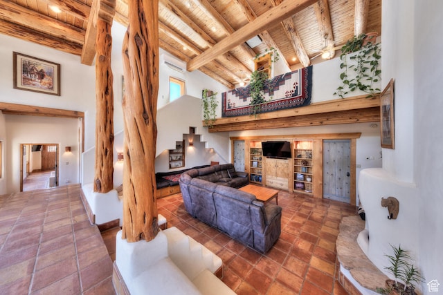 70 Desert Solitaire Rd, Moab, UT 84532 - living room with a wooden ceiling with exposed beams, a towering ceiling, and stairs