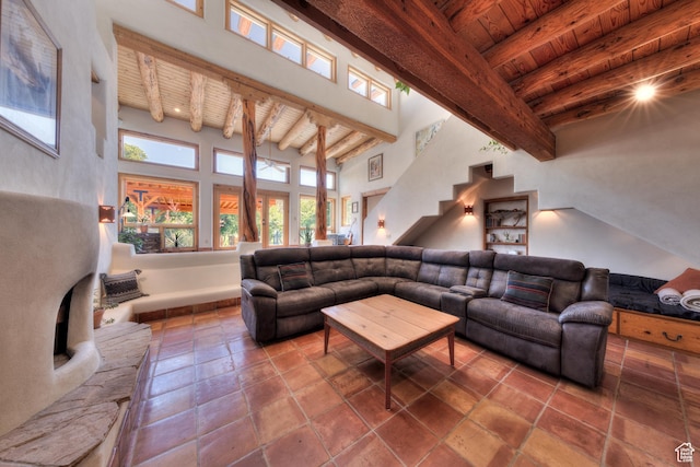 70 Desert Solitaire Rd, Moab, UT 84532 - living room with a wood ceiling with exposed beams, a towering ceiling, and stairs